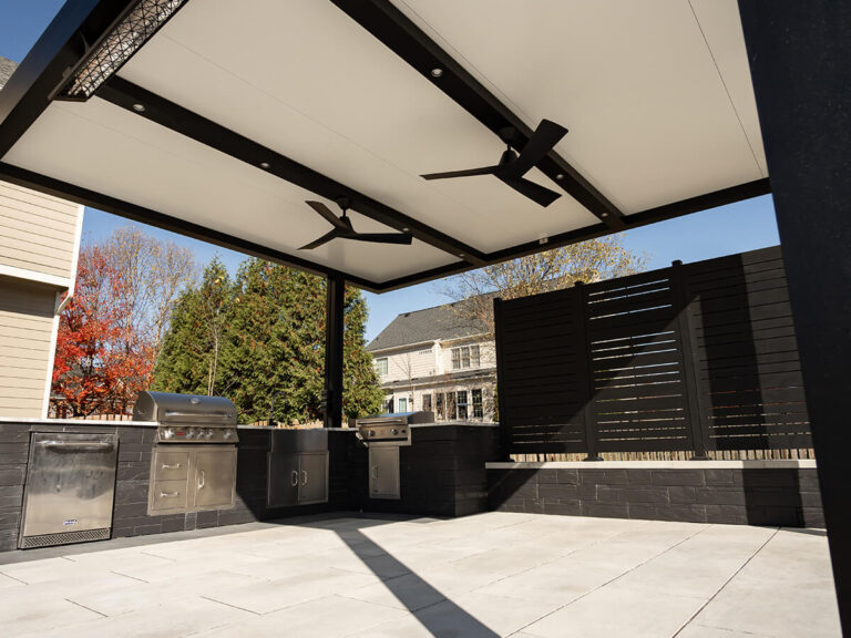 R-SHADE™ R-SHADE™ insulated patio cover with integrated lighting and ceiling fans, showcasing durable design and minimal maintenance.