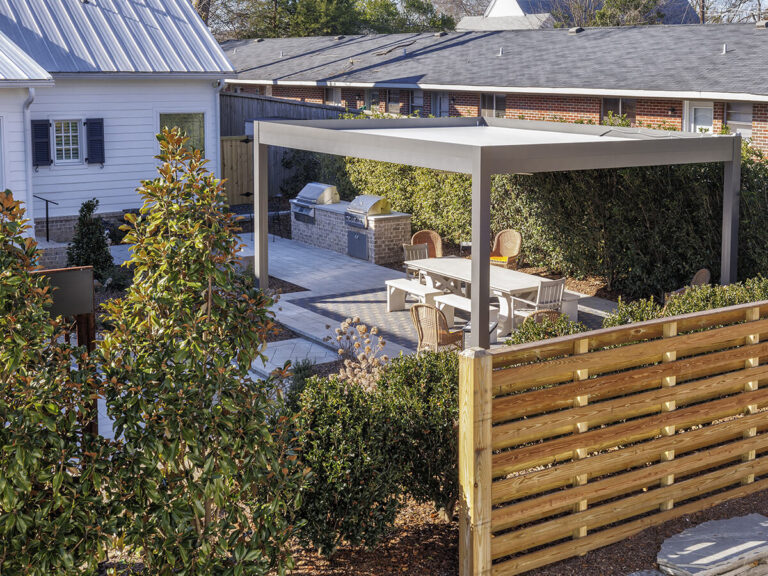 R-SHADE™ R-SHADE™ insulated patio cover with integrated grill and dining area, showcasing durable frame and minimal maintenance.