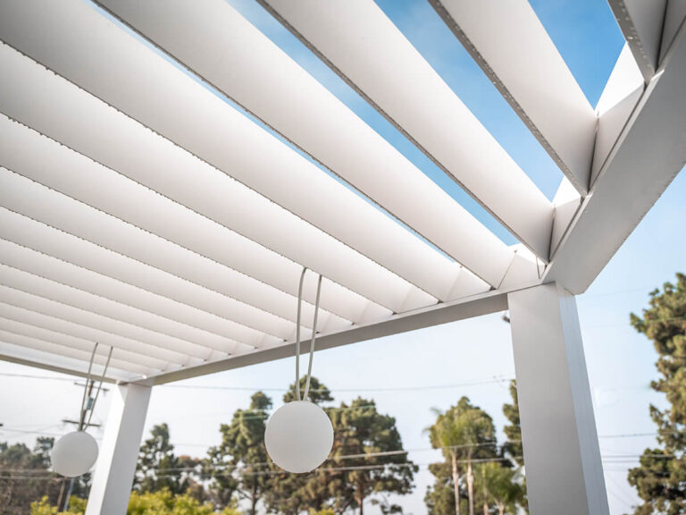R-BREEZE™ slatted roof pergola with integrated lighting and customizable shade solutions.